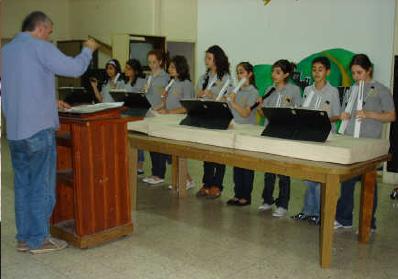 Fadi, CEF, Nazareth , directs a local school's bell choir